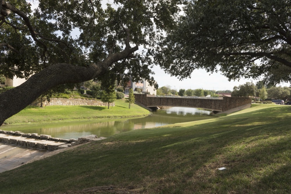 A canal and parkland in Las Colinas, Irving, Texas